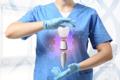 dentist looking like they are holding a digital dental implant