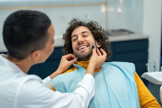 male patient seeing an implant dentist