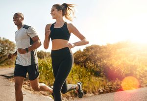 Man and woman jogging together outside