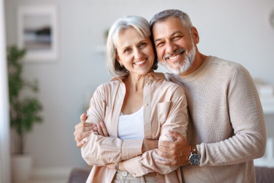 older couple hugging and smiling