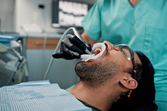 Man undergoing a dental cleaning