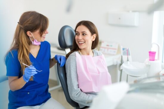 female patient smiling at the dentist