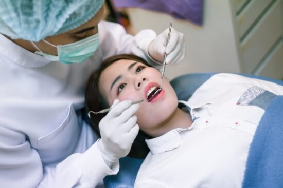 patient receiving dental care from dentist