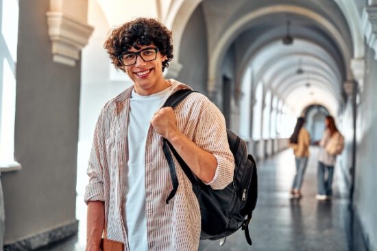 smiling college student with glasses