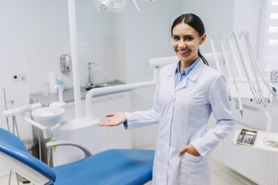 dentist pointing to the treatment chair