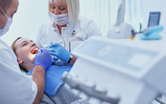 female patient undergoing dental implant care