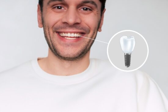 young man smiling with a dental implant