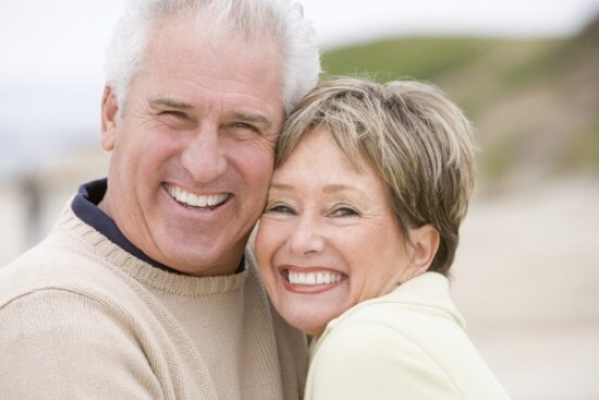 older couple hugging tightly and smiling