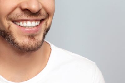 up-close view of a man's smile