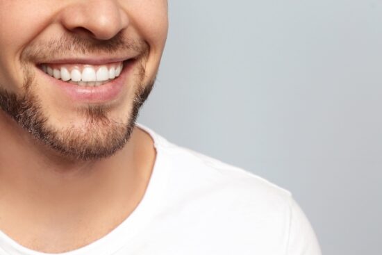 up-close view of a man's smile