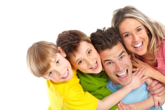 happy family of four smiling