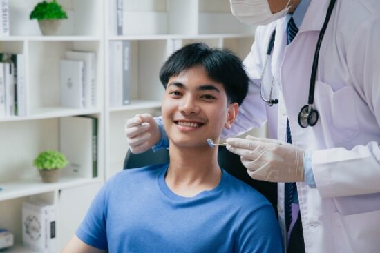 young man seated in the dentist's chair